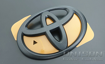 RAV4UNISON-純正エンブレム改 Tマークエンブレム(Adventure純正近似色)